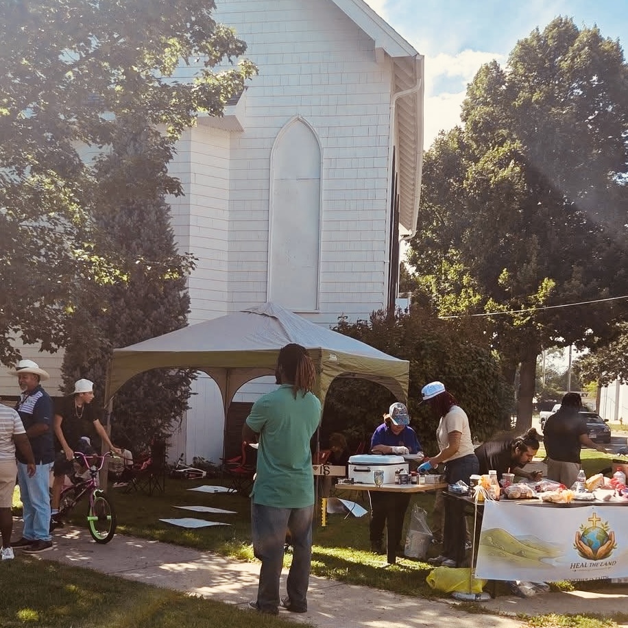 The tent and serving line set up beside the church
